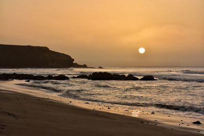 Scenic view of sea against sky during sunset