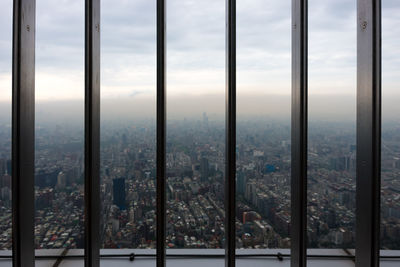 View of cityscape through window