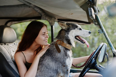 Portrait of young woman with dog