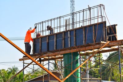 Low angle view of construction site against sky