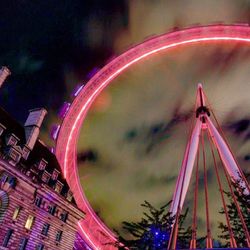 Low angle view of illuminated ferris wheel