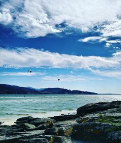 Scenic view of sea against cloudy sky