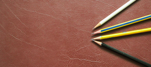 High angle view of colored pencils on table