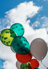 Low angle view of balloons against sky