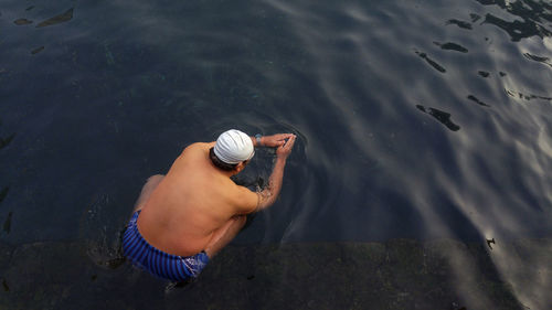 High angle view of man swimming in water