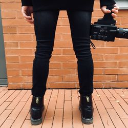 Low section of man standing on floor