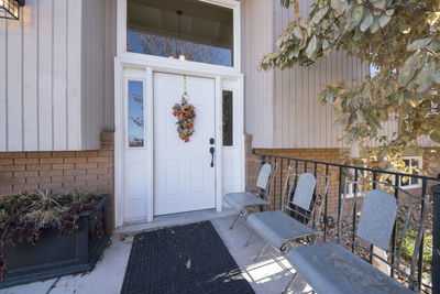 Potted plants on window of house