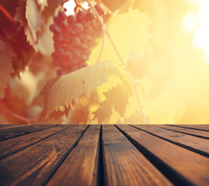 Close-up of ice cream on table against sky during sunset