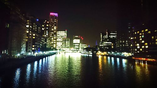 Reflection of illuminated buildings in water at night