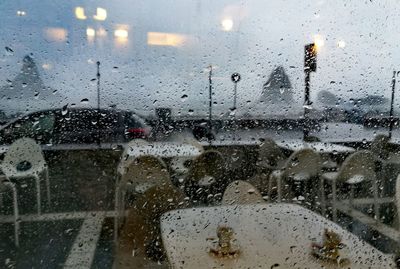 Raindrops on glass window in rainy season