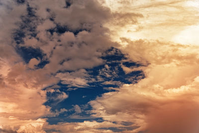 Low angle view of clouds in sky during sunset