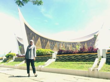 Full length portrait of man standing against sky