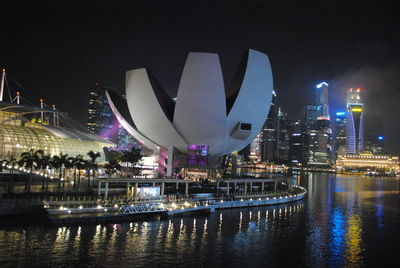 Artscience museum in illuminated city at night