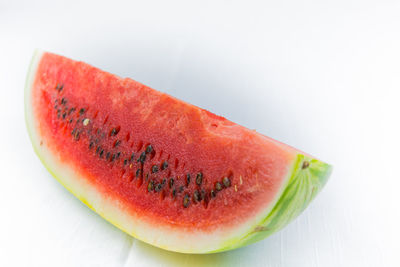 Close-up of fruit against white background