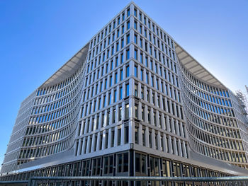 Low angle view of modern buildings against clear sky