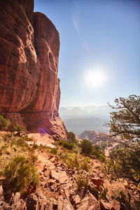 Rock formations on landscape against sky