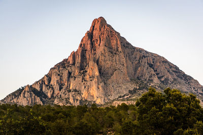 Scenic view of rocky mountains against clear sky