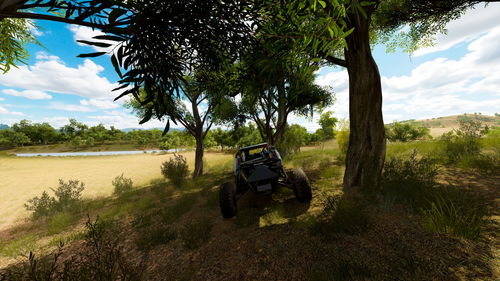 Tractor on field against sky