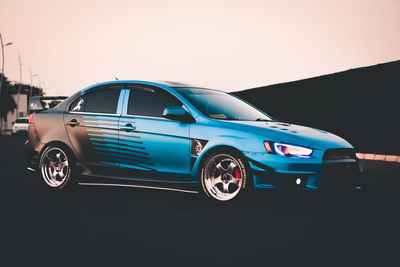 Vintage car on road against clear sky