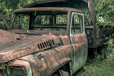 Abandoned car on field