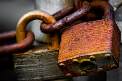 Close-up of rusty metal on wood