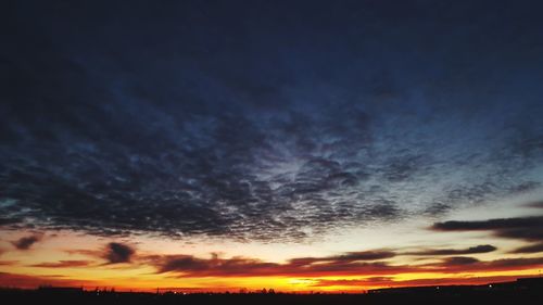 Low angle view of dramatic sky during sunset