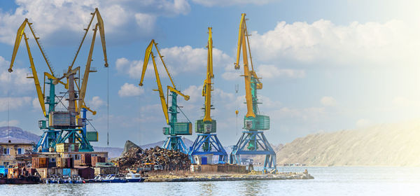 Crane at the scrapyard in the seaport