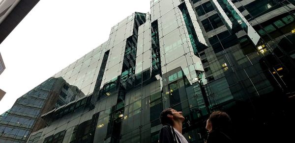 Low angle view of buildings against sky in city