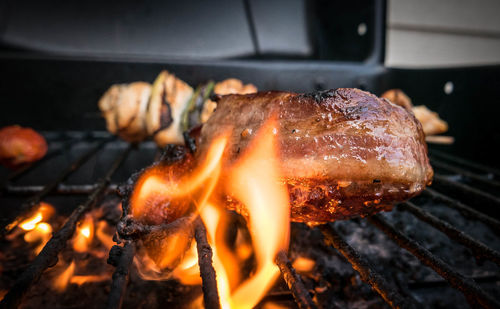 Close-up of meat preparing on barbeque grill