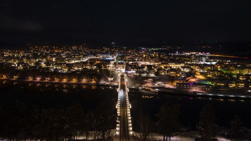 High angle view of illuminated city buildings at night