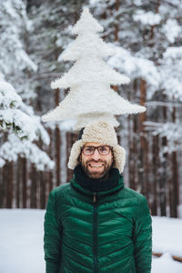 Portrait of smiling man in snow