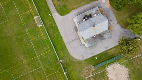 Aerial view of built structure by soccer field