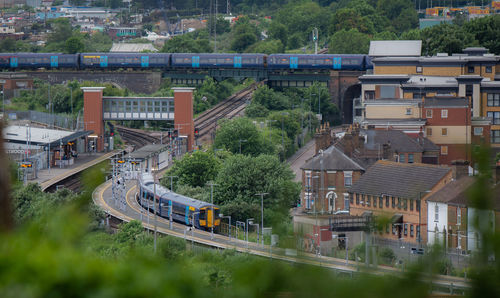 High angle view of bridge over river by buildings in city