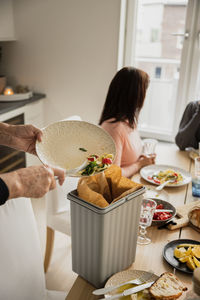 Family cleaning after having dinner