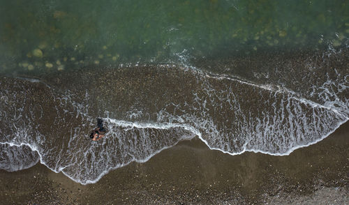 Man splashing water in sea