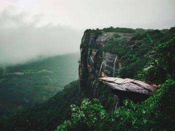 Scenic view of rocks on landscape against sky