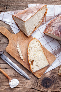 High angle view of bread on cutting board