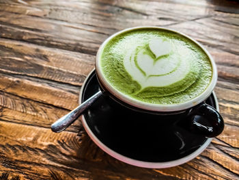 High angle view of coffee cup on table