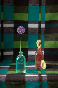 Close-up of glass bottle on table