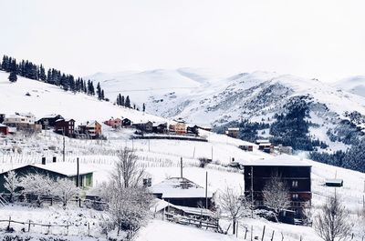 High angle view of houses on snow covered landscape