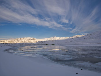 Scenic view of snowcapped mountains against sky