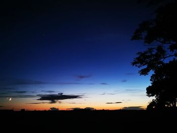 Scenic view of silhouette landscape against sky at sunset