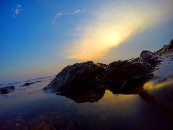 Scenic view of sea at sunset