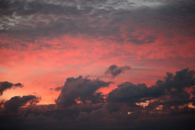 Low angle view of dramatic sky during sunset