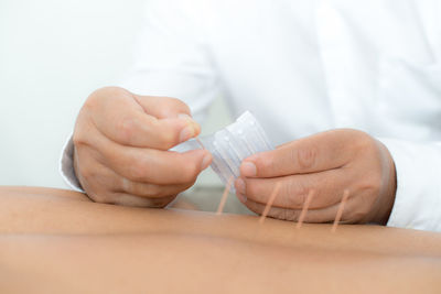 Midsection of man working