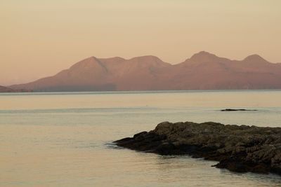 Scenic view of sea at sunset