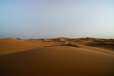 Scenic view of desert against clear sky