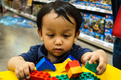 Portrait of cute boy with toy