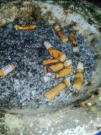 High angle view of cigarette smoking in city