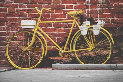 Bicycle leaning on wall